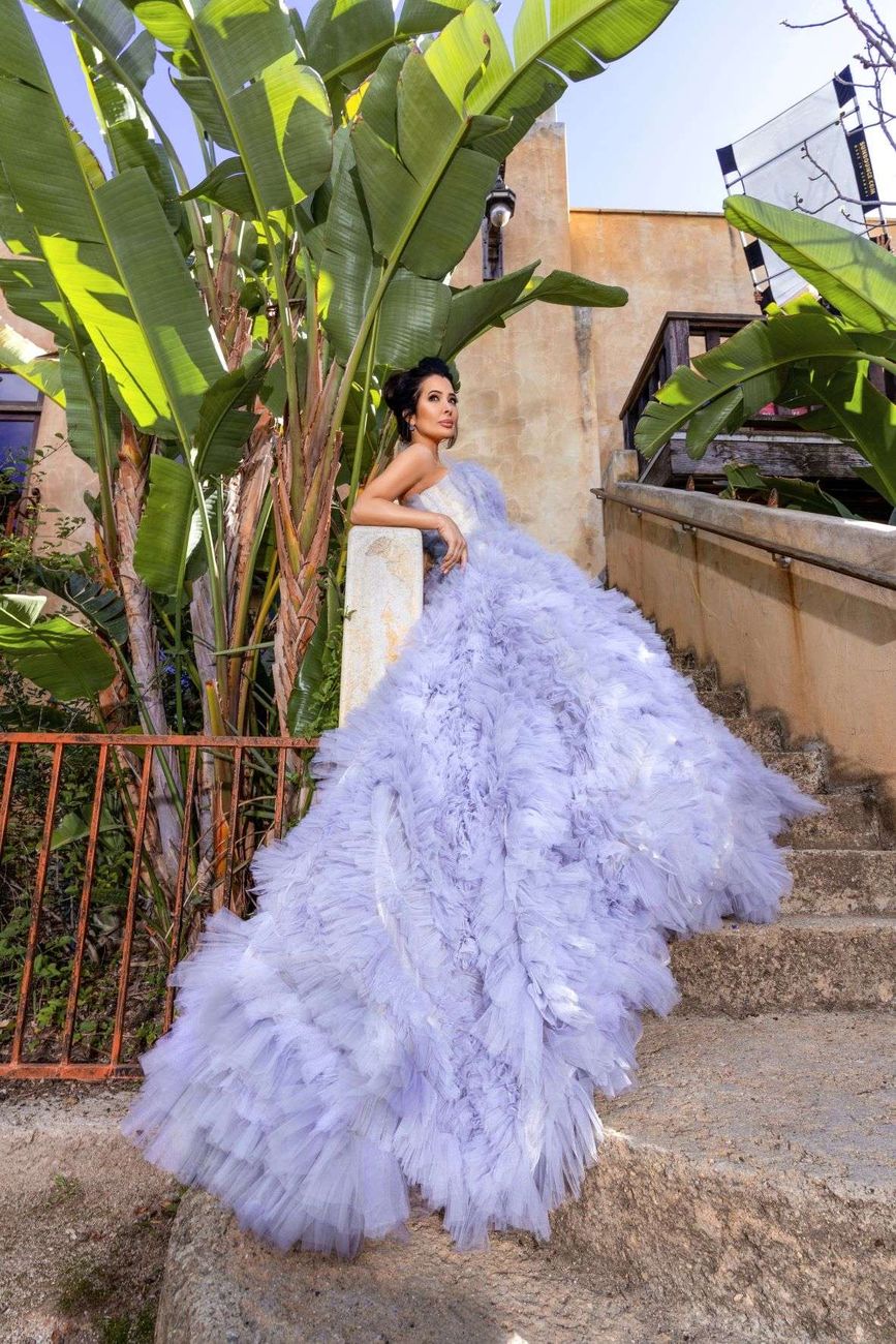 Amy Weber in a lavender ostrich feather gown with a full train, styled by Quentin Fears